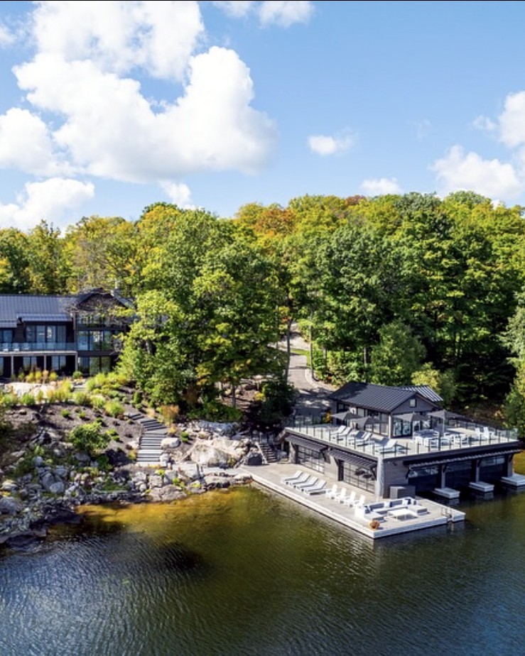Luxury lakefront cottage on Lake Rosseau, aerial view of boathouse and dock